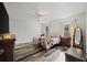 Main bedroom with plank flooring, natural lighting and neutral paint throughout at 9483 Cr 747, Webster, FL 33597
