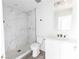 Modern bathroom featuring a white vanity, a stone countertop, and a tiled walk-in shower at Lot 21 Indian Estates Cr 423, Lake Panasoffkee, FL 33538