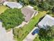 Aerial view shows the layout of the home and backyard within the surrounding community at 1011 Dundee Cir, Leesburg, FL 34788