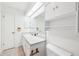 Bathroom featuring a single sink vanity, a skylight, and tile flooring at 1011 Dundee Cir, Leesburg, FL 34788