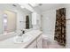 Bathroom featuring a vanity sink, toilet, shower, and tile flooring at 1011 Dundee Cir, Leesburg, FL 34788
