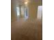 Spacious bedroom with carpet, ceiling fan, ensuite bathroom, and walk-in closet at 1011 Dundee Cir, Leesburg, FL 34788