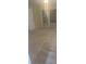 Neutral bedroom features new carpet and double doors to the backyard at 1011 Dundee Cir, Leesburg, FL 34788