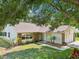 Attractive single-Gathering home with lush landscaping, healthy green lawn and stone accents at 1011 Dundee Cir, Leesburg, FL 34788