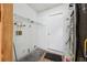 Functional utility room with shelving, tile accents, and door at 1011 Dundee Cir, Leesburg, FL 34788