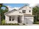 Charming two-story home boasting elegant architectural details and a well-manicured front yard at 10114 Ballast Dr, Orlando, FL 32827