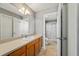 Neutral bathroom features a spacious sink and vanity, with access to a stand-up shower at 1014 Nash Loop, The Villages, FL 32162