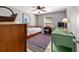Cozy bedroom featuring a daybed, ceiling fan, and charming decor at 1014 Nash Loop, The Villages, FL 32162