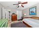 Bright bedroom with a daybed, closet, and ensuite bathroom at 1014 Nash Loop, The Villages, FL 32162