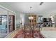 Bright dining area showing access to the lanai and open plan living at 1014 Nash Loop, The Villages, FL 32162