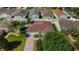 Well-maintained single-Gathering home with lush lawn and a paved driveway leading to an attached garage at 1014 Nash Loop, The Villages, FL 32162