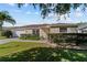 Beautiful single-story home featuring a well-maintained lawn and tidy landscaping at 1014 Nash Loop, The Villages, FL 32162
