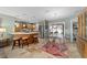 Bright kitchen features wood cabinets, stainless steel appliances, and breakfast bar seating at 1014 Nash Loop, The Villages, FL 32162