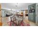 Open floor plan combines the dining and living areas, complete with tile flooring at 1014 Nash Loop, The Villages, FL 32162