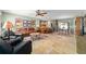 Inviting living room with modern decor, open floor plan, and a breakfast bar at 1014 Nash Loop, The Villages, FL 32162
