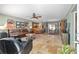Spacious open-concept living room with a breakfast bar and tile flooring at 1014 Nash Loop, The Villages, FL 32162