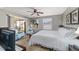 Well-lit main bedroom with a ceiling fan and sliding glass doors to the patio at 1014 Nash Loop, The Villages, FL 32162