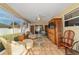 Sunroom with comfortable seating, tile flooring, and backyard view at 1014 Nash Loop, The Villages, FL 32162
