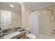 This bathroom features stylish countertops, cabinets, a shower and bathtub combo at 1175 Johnston Path, The Villages, FL 32162