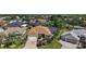 Charming single-story home featuring a brick driveway, well-manicured landscaping, and screened-in lanai at 1175 Johnston Path, The Villages, FL 32162