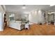 Bright, open living room with hardwood floors, neutral tones, and decorative wall accents at 1175 Johnston Path, The Villages, FL 32162