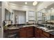 Bright bathroom showcasing an expansive countertop, cabinets, dual sinks and vanity area at 1175 Johnston Path, The Villages, FL 32162