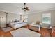 Comfortable main bedroom featuring a ceiling fan and a cozy reading nook at 1175 Johnston Path, The Villages, FL 32162