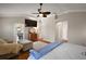 This spacious main bedroom offers a ceiling fan, tv, dresser and plenty of room at 1175 Johnston Path, The Villages, FL 32162