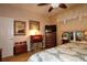 Bedroom with a cozy corner, writing desk, TV and large mirror at 11868 Se 91St Cir, Summerfield, FL 34491