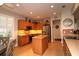 Spacious kitchen with island, stainless steel appliances, and breakfast nook for casual dining at 11868 Se 91St Cir, Summerfield, FL 34491