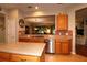Modern kitchen with stainless steel appliances and granite countertops, perfect for cooking and entertaining at 11868 Se 91St Cir, Summerfield, FL 34491