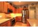 Well-equipped kitchen featuring updated appliances, granite counters, and ample cabinet space for storage at 11868 Se 91St Cir, Summerfield, FL 34491