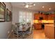 Eat-in kitchen featuring stainless appliances, granite countertops, and plenty of natural light from the window at 11868 Se 91St Cir, Summerfield, FL 34491