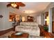 Open-concept living room features a comfortable sofa, views into the dining area, and hardwood floors at 11868 Se 91St Cir, Summerfield, FL 34491