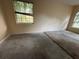 Bare bedroom with partial carpet, showing opportunities for renovation and personalization at 1209 Cathcart Cir, Sanford, FL 32771