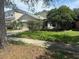 Attractive single-Gathering home with a two-car garage and lush landscaping in a suburban neighborhood at 1209 Cathcart Cir, Sanford, FL 32771