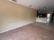 Large living space with tile flooring, an archway, and access to the kitchen, ideal for entertaining at 1209 Cathcart Cir, Sanford, FL 32771