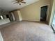 A spacious living room with tile flooring leads to other rooms in the home at 1209 Cathcart Cir, Sanford, FL 32771