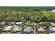 Aerial view of a charming home nestled among lush trees, highlighting its serene location at 124A Shady Ln, Eustis, FL 32726