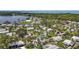 This aerial view of the community showcases the proximity to the lake and lush landscaping at 124A Shady Ln, Eustis, FL 32726