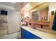 Classic bathroom with vanity, framed mirror and shower with glass door at 124A Shady Ln, Eustis, FL 32726