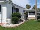 A lovely exterior view shows the home's well kept lawn and landscaping at 124A Shady Ln, Eustis, FL 32726