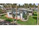 Charming home with a well maintained lawn, white picket fence, and colorful landscaping at 124A Shady Ln, Eustis, FL 32726