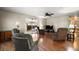 This living room is a large space with hardwood floors and lots of seating at 124A Shady Ln, Eustis, FL 32726