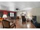 Spacious living room featuring hardwood floors, ceiling fan, and a sliding glass door at 124A Shady Ln, Eustis, FL 32726
