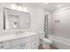 Bathroom featuring a single sink vanity with a shower-tub combo with modern tile at 1313 Arredondo Dr, The Villages, FL 32162