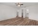 Clean and bright bedroom with laminate flooring, ceiling fan, and convenient access to the walk-in closet at 1313 Arredondo Dr, The Villages, FL 32162