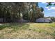 Spacious backyard with privacy fence and plenty of mature trees at 13137 Kansas Ave, Astatula, FL 34705