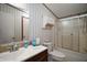 Bathroom featuring a tub and shower combination and tile countertop at 13137 Kansas Ave, Astatula, FL 34705