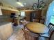 Open kitchen and dining area offer an ideal spot for meal preparation and enjoyment at 1512 Nueva Pl, The Villages, FL 32159